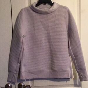 All in motion, zip side sweater. New without tags.